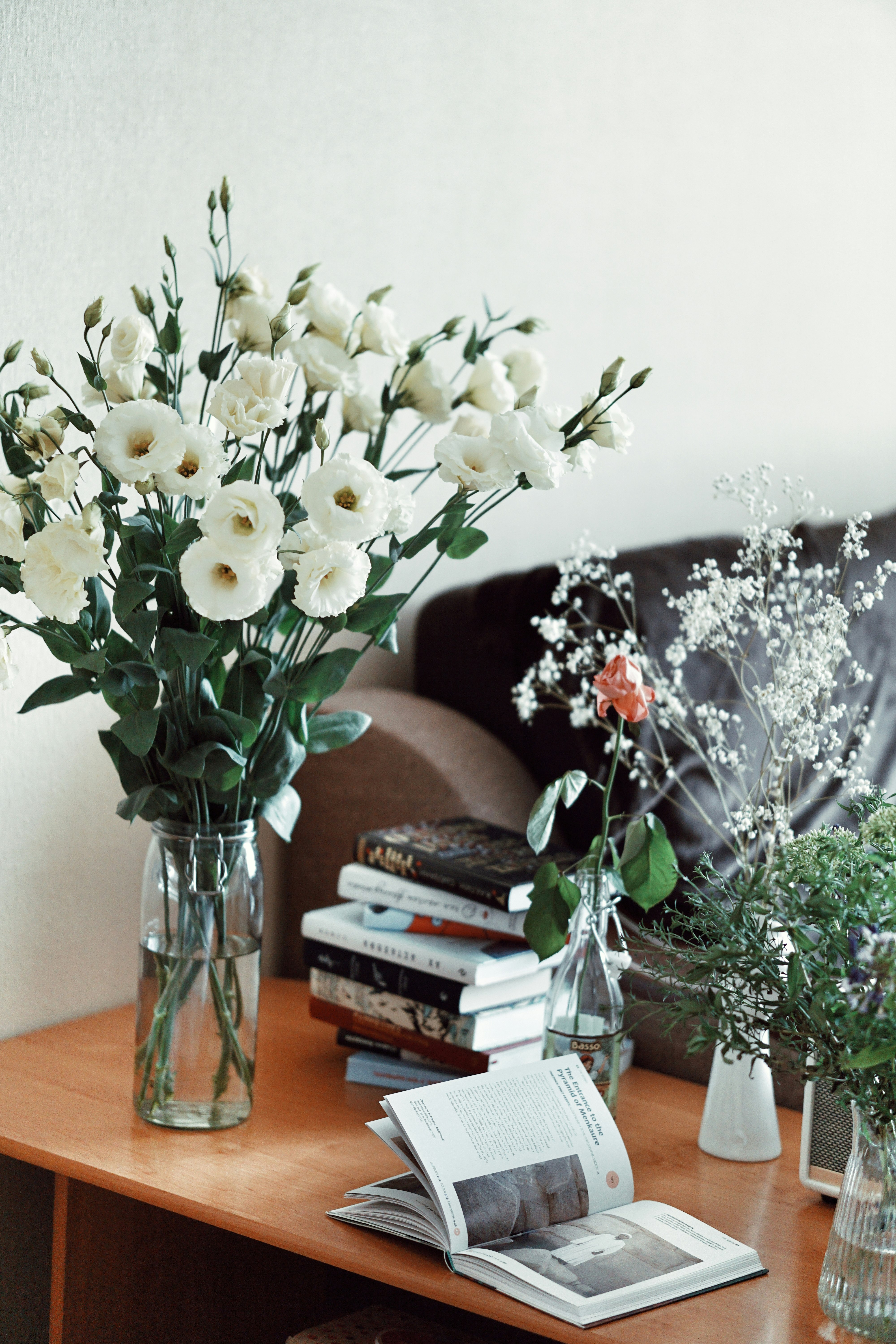 white flowers in clear glass vase